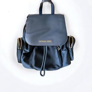Dark blue Michael Kors backpack style purse